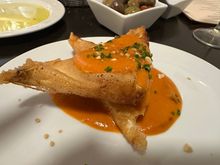 Brik pastry filled with creamy white cheese and hefty chunks of prawns