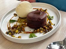 Turkish coffee chocolate cake, roasted pistachios, mastic ice cream and chocolate pearls 