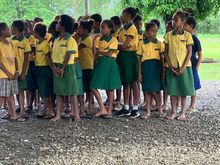 Young class waiting to sing the PNG national anthem