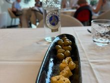 Complimentary plate of marinated local cheese and green olives at BEIRAMAR