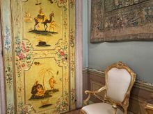 The Tapestry Room - One of the original furnishings is the yellow lacquered door decorated with oriental patterns. 