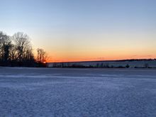 First sunset of 2026, with a field of snow.