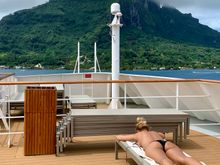 Joyce catching some rays in front of the Bora Bora mountains 