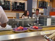 The food comes around on a conveyor belt and you just grab what you want!