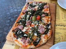 Chicory and sausage flatbread at Tonnarello's with a perfect crust.