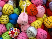 Colorful “monkeys” on which people write wishes 