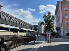 Hotel is the pink building, bicycle parking and train station adjacent. 