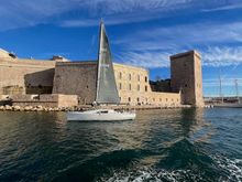 Sailboat passing Fort St. Jean