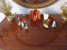 Christmas nativity scene with santons and a carved wood crèche from Oberammergau.