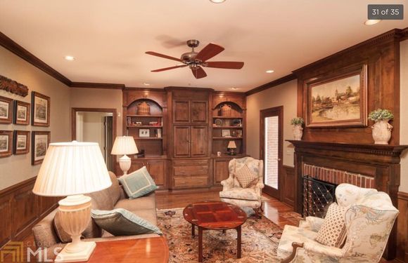 
Family room, very cozy, with two French doors to screened porch
