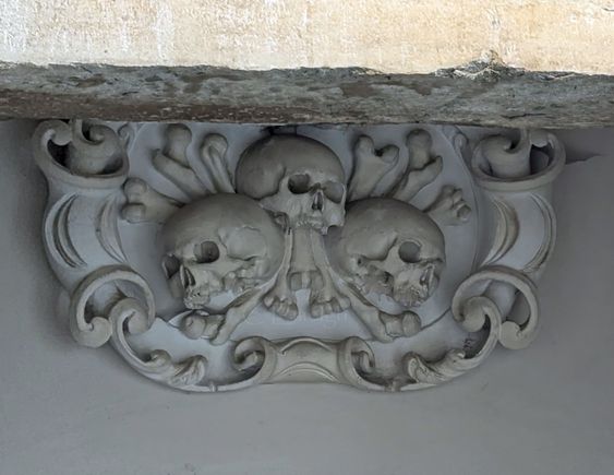 Over the entrance to the crypt