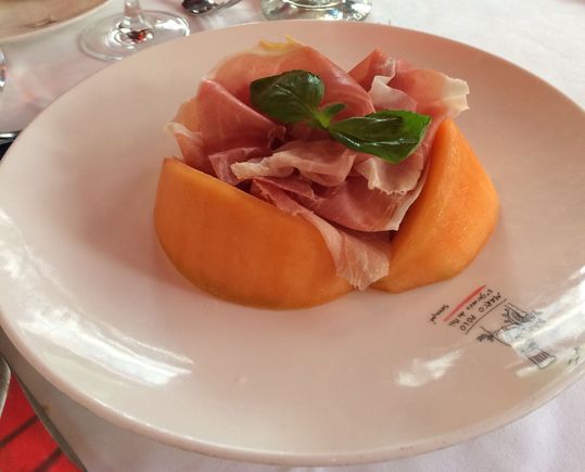 Beautifully plated melon and prosciutto 