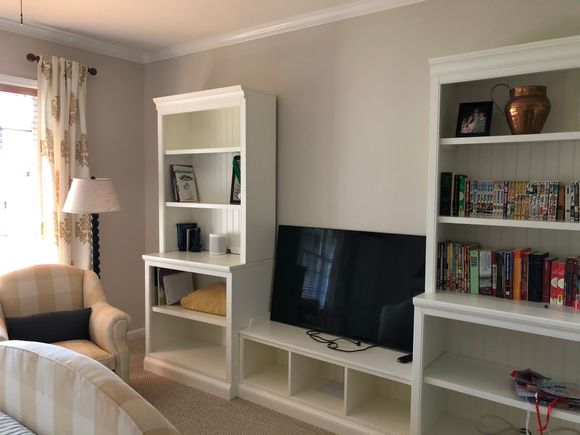 
Waited four months for these step back bookcases and bench to arrive.  Baskets on order for bench cubbies and bottom row of shelving.  Tv screen (DS2 is a rabid gamer) will be wall mounted about halfway up the wall so he can watch or play from the bed.  The parsons chair at the desk is on casters so he can use that to play also.  Still looking for the right fabric for bench cushion.  