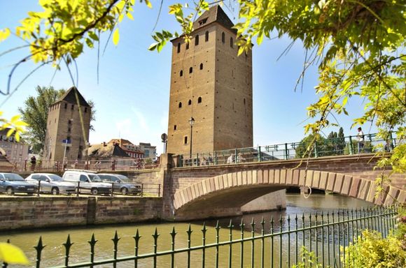 The Barrage Vauban
This fortified bridge was a cornerstone of the city’s defenses from the 1600s when it was built, until as recently as the Franco-Prussian war in 1870.  The walkway inside has some interesting stonework your camera will love, but even better is: