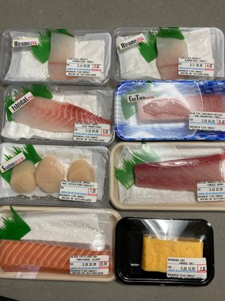 Packages of sashimi-grade dish from the Japanese fish market. I sliced them at home. 