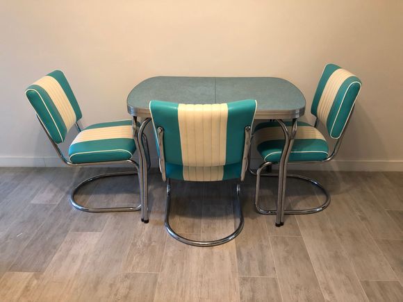 Here is our little treasure. The tabletop has a wavy design which my phone won’t capture. There’s a fourth chair too. 

We’re leaving Friday and we have gotten most of what we had wanted to get done accomplished.
I will miss this little house which already feels like my real home. 

We’re eating out  with a friend tonight at our favorite Chinese place. I had wanted to try a new Eritrean place but the chairs look awful and I’m not up for discomfort.