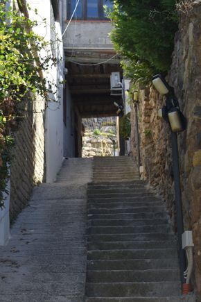 At about the midway point in the stairs going up.