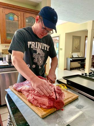 The 30-year-old preparing to trim and separate the 18 pound brisket for Saturday night’s dinner. I helped.