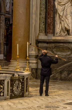 Lighting the candles at the basilica Laterano.