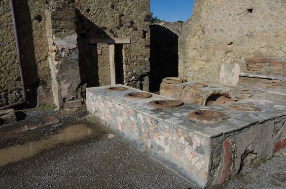 This Herculaneum fast food joint reminded me that Pompeii has recently uncovered some more exceptional remains of eateries just like this. Each vat would've contained a different food: stews, seafood, garum, wine, grains and more.