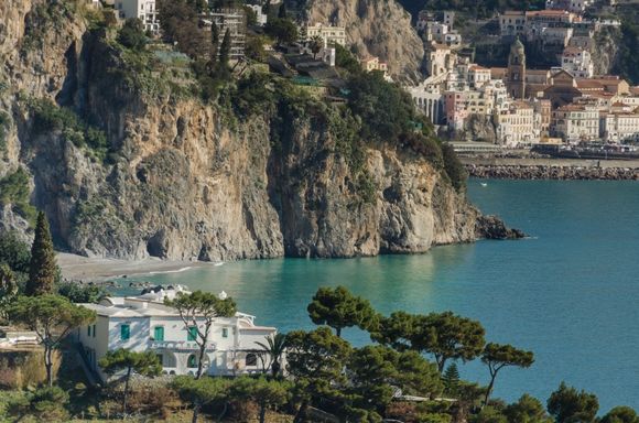 Loren's aforementioned mansion with Amalfi in the background. Her estate also includes a perched chapel out at the tip of her promontory, just to the right of those descending trees. 