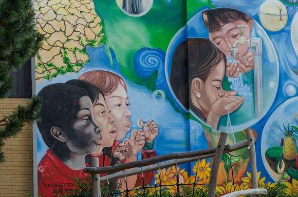 A mural showing kids at small local Parc Toto-Bissainthe. Marie Clotide Bissainthe ('Toto') was a Haitian-born comic.