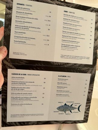 STARTERS; CRUDO (RAW DISHES); SHORT LIST OF CLASSIC DISHES; GRILLED DISHES. 
  AT LOWER RIGHT IS A DIAGRAM OF A TUNA, IDENTIFYING SOME OF THE PARTS USED BY THE KITCHEN.  These are the cartas offered to the diners at the bar, but all of the dishes (from the longer menu) can also be taken while seated at the bar.
A a single diner, I preferred to eat at the bar, so I could watch the action.   Bar tables are high-top, so keep that in mind if that type of seating is uncomfortable for you.
