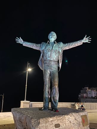 Statue of Domenico Modugno, Italian singer and author of the song, "Nel Blu Dipinto di Blu", known as "Volare", who was born in Polignano a Mare in 1928