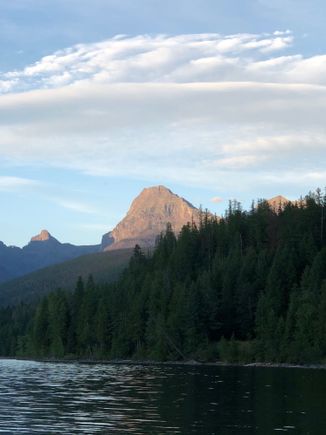 Tall pile of rocks with the sunshine waining.