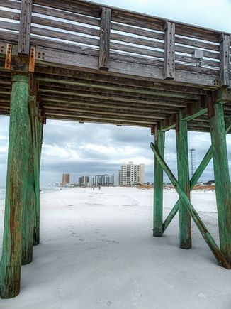 Pier structure framing the nearest buildings 