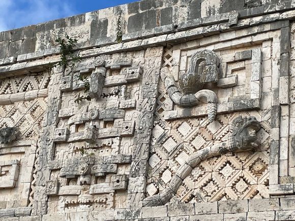 This is from the Nunnery Quadrangle.  There is a giant serpent and a person's head coming out of the mouth.