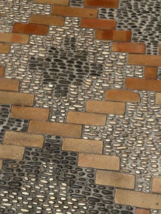 Stone and brickiest into cement (?). The first thing that struck me as I entered the hotel for the first time.