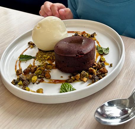 Turkish coffee chocolate cake, roasted pistachios, mastic ice cream and chocolate pearls 