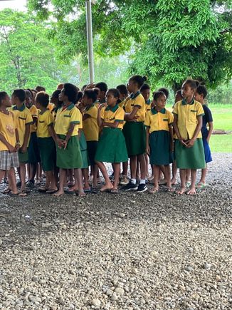 Young class waiting to sing the PNG national anthem