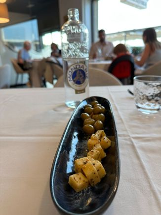 Complimentary plate of marinated local cheese and green olives at BEIRAMAR