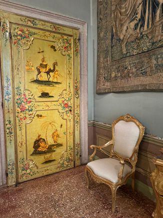 The Tapestry Room - One of the original furnishings is the yellow lacquered door decorated with oriental patterns. 