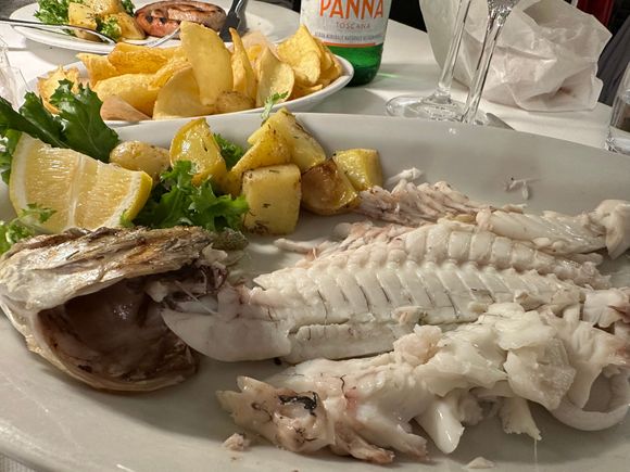 I chose a type of bream from he display of fish and it was excellent.   75 euro per kilo seems to be the going rate around here.  This grilled fish, which I had trouble finishing,, cost 28.50 euro and came with those lovely roasted potatoes.  Total bill for two=58 euro, with wine and water and coper to.  Recommend.