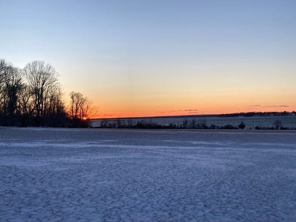First sunset of 2026, with a field of snow.