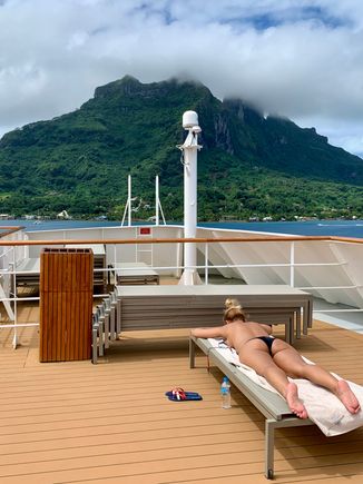 Joyce catching some rays in front of the Bora Bora mountains 