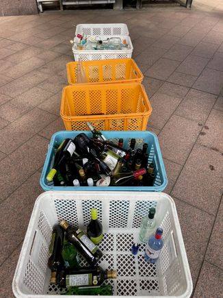 I was walking past a fairly large apartment complex, this is about 7AM and I see an older gentleman come out and drop two wine bottles in these bins.  Must be recycle day, or maybe this is the Kanazawa Playboy Club.