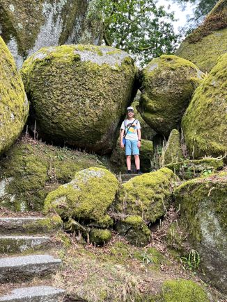My son among the huge boulders up on Penha