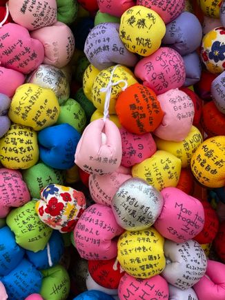 Colorful “monkeys” on which people write wishes 