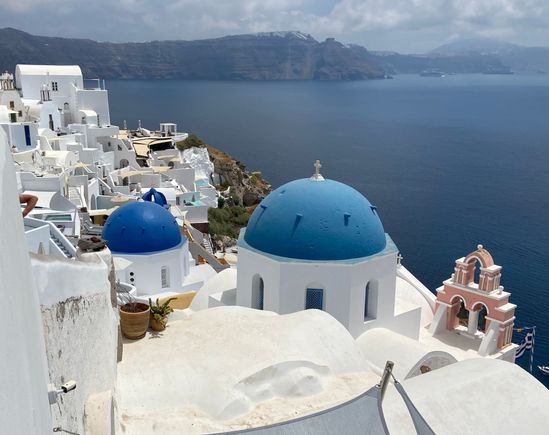 Classic white-washed buildings with blue domes!