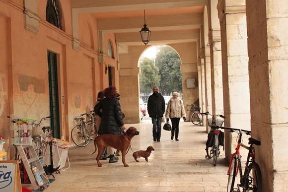 Under the riverside portico.