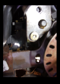 Best pic I could take, no bolt in the top hole.