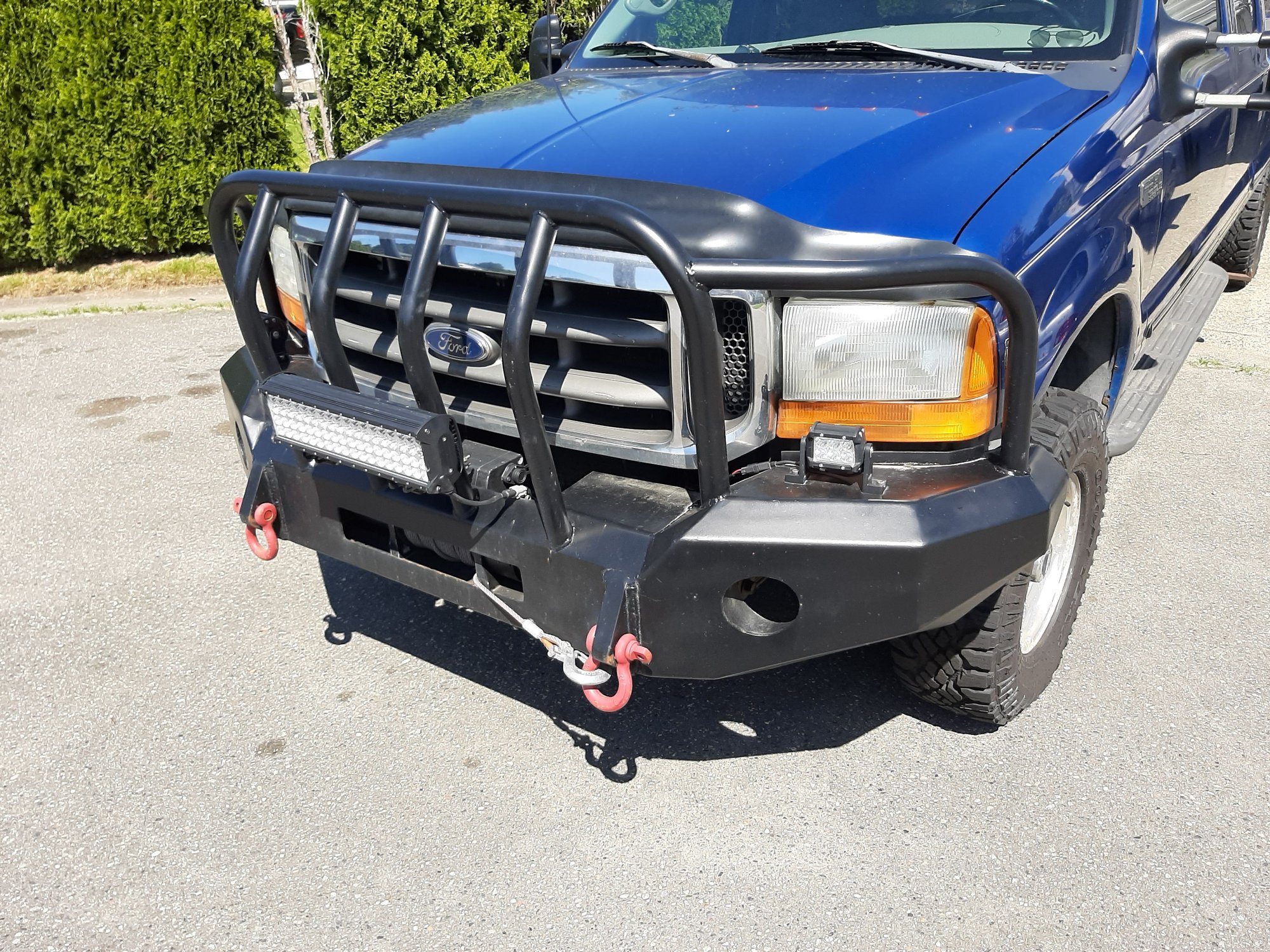 Just thought I would send in a pic of my front winch bumper. Great story where a buddy is a welder/fabricator and a guy who wanted an extreme hd bumper for pushing around cars at his wrecking yard didnt show up to pay the bill. I bought it for $900. Its so heavy! 3/16
