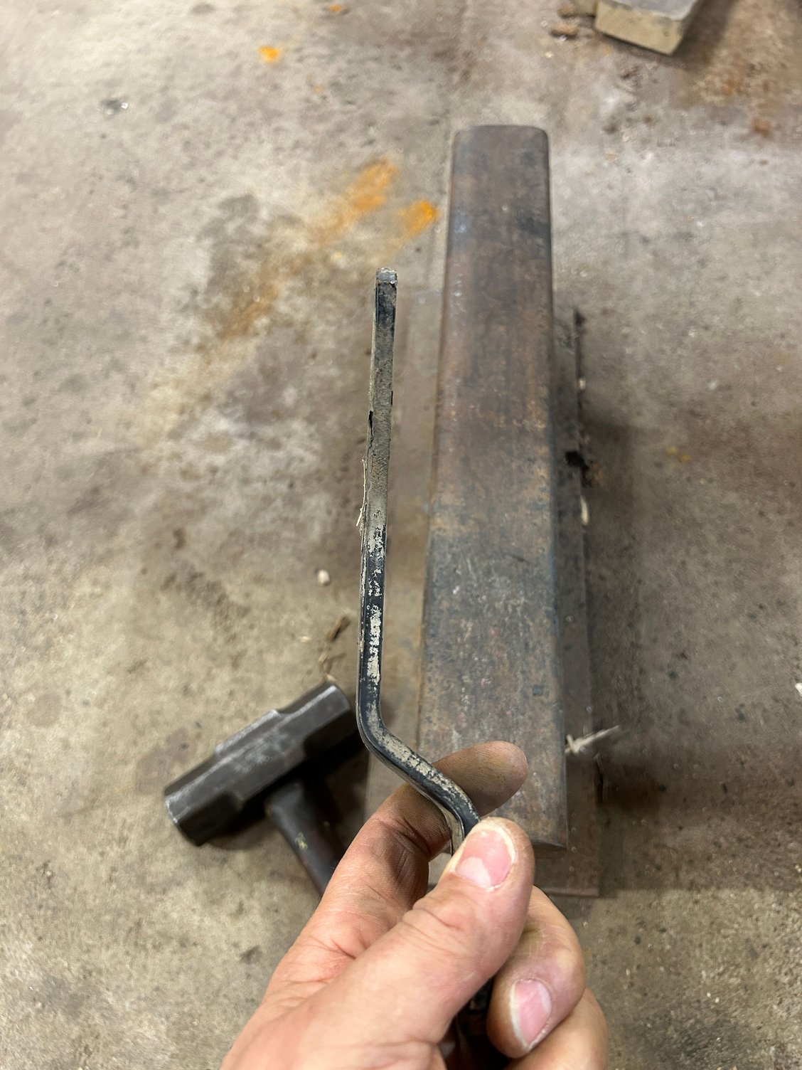 So I set this up on the table in preparation for decreasing in paint. Next, I wanted to modify the bracket that holds the alternator and also on top it held the air pump that was locked up, which I�m not going to put back on. And I didn�t want a big old chunk of metal just sticking up and because I�m still doing this as cheap as possible I decided to cut it up and then grinding edges and then prep it for paint turned out pretty good. I�m happy enough with it. Here�s the chunk that I cut off.