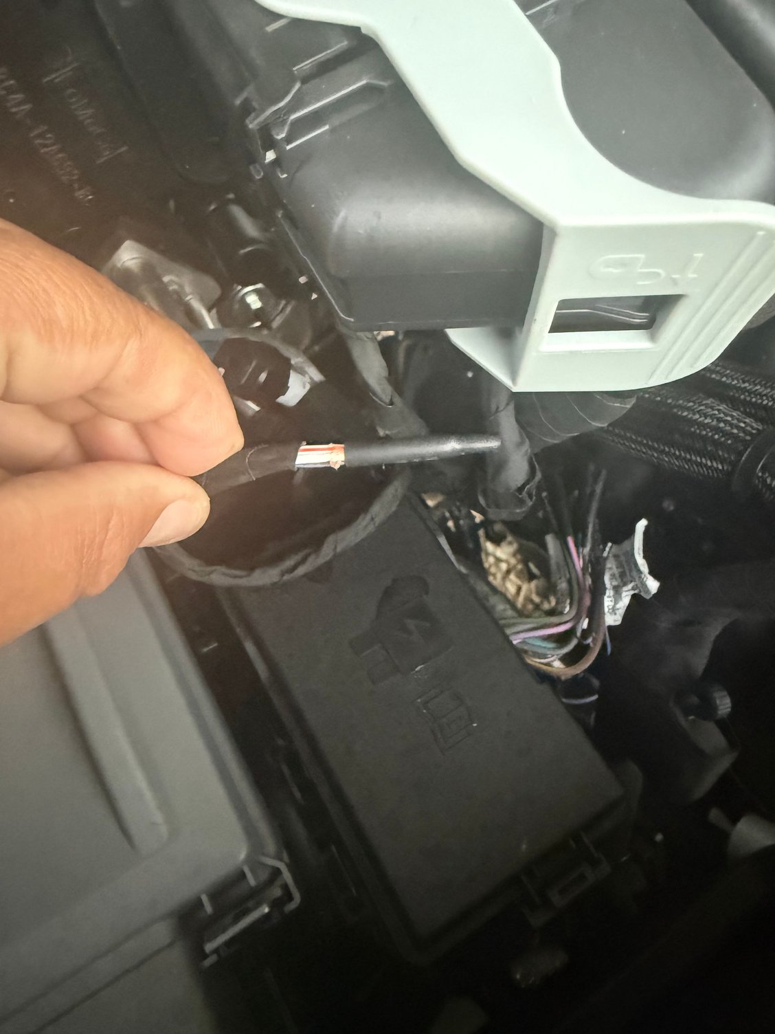 The upfitter wire is then connected to one of these pass through wires that were taped to the wire bundle?  These go through the firewall and should be located under the dash on the passenger side. 