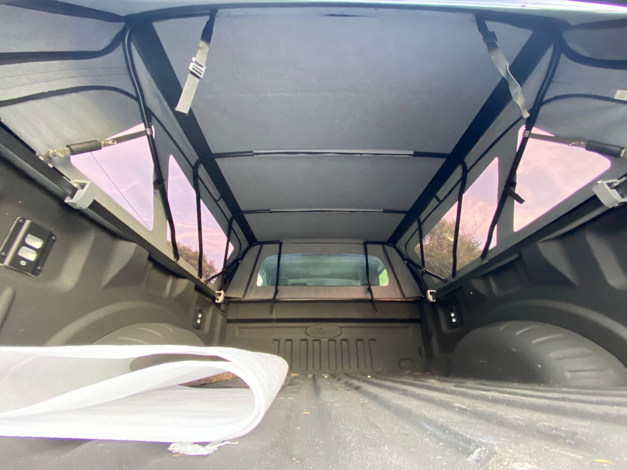 Straps in foreground are for cinching the rolled up rear panel.