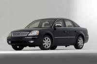 First brand new car I ever purchased. '06 Ford Five Hundred Limited.  Black exterior, black leather interior, sun roof, interior wood trim, power everything and roomy as hell.